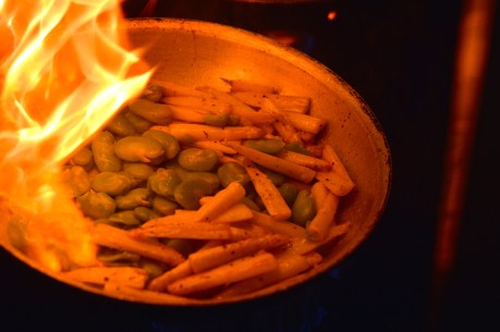 Fava beans and white asparagus tossed over heat
